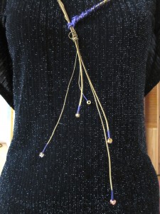 Guitar string necklace on recoutured dress